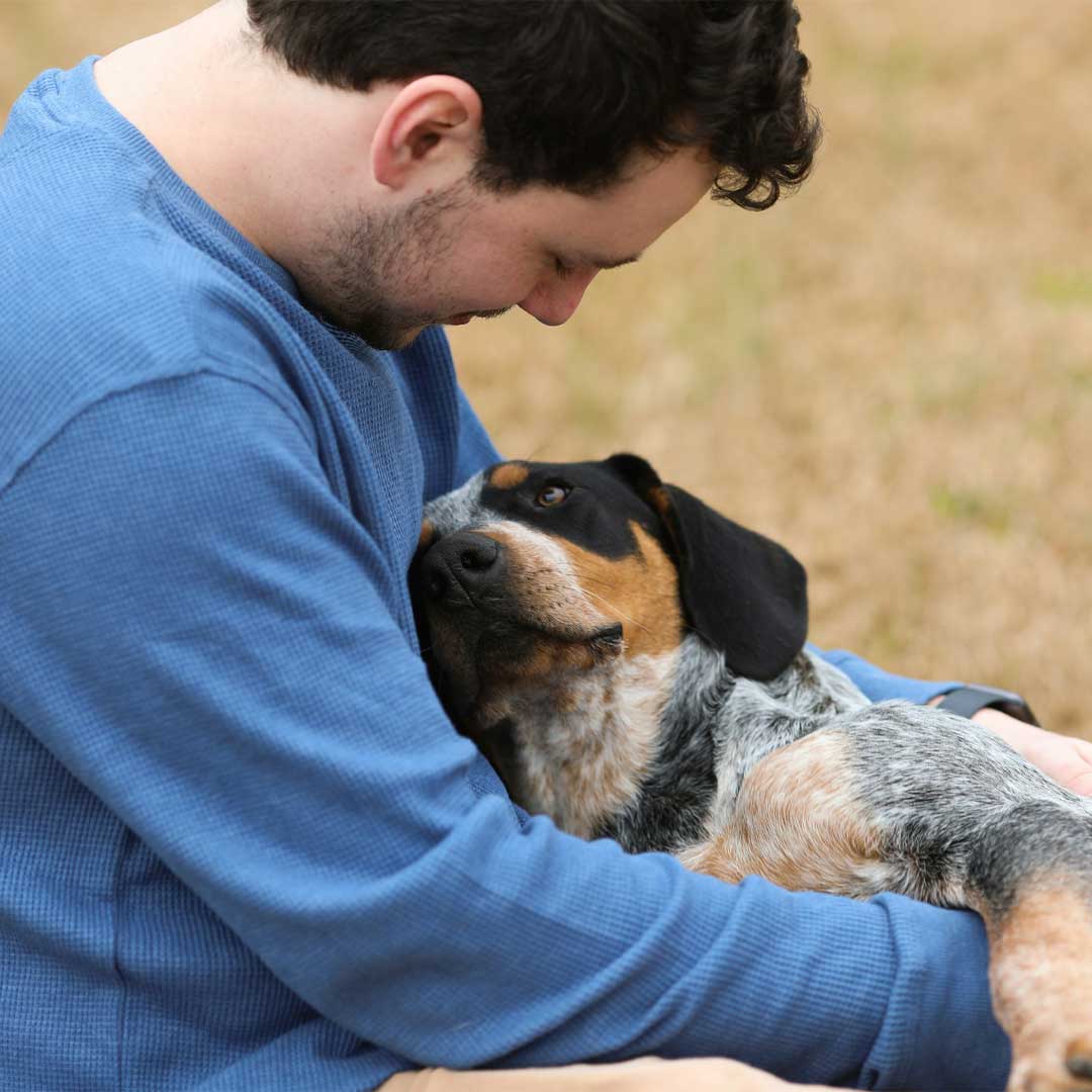 Loving owner with his dog.